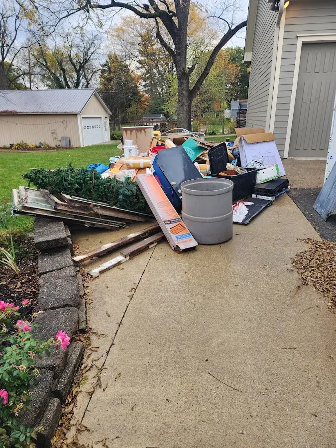 Dumpster being loaded with debris for Commercial Dumpster Rental in Walthourville